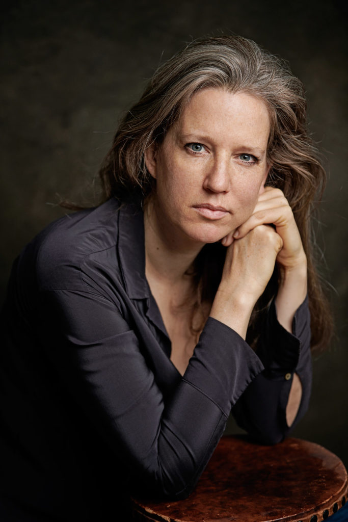 wonderful headshot of beautiful woman opera singer in studio